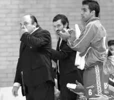 Ricardo Andorinho standing on the Portland San Antonio bench beside the coach in the closing minutes of a match
